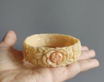 1930s carved celluloid bangle, ivory and pink, chrysanthemums, lily of the valley, roses