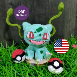 May include: A crocheted Bulbasaur figure in light blue, with red eyes and a smiling mouth. Two green vines extend from its back. Two crocheted Poké Balls and a "PDF Pattern" graphic are also visible.