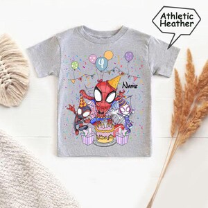 May include: Athletic Heather gray t-shirt featuring a colorful Spider-Man birthday design. The graphic includes Spider-Man characters, a birthday cake, balloons, and the number 4. The word "Name" is also visible.