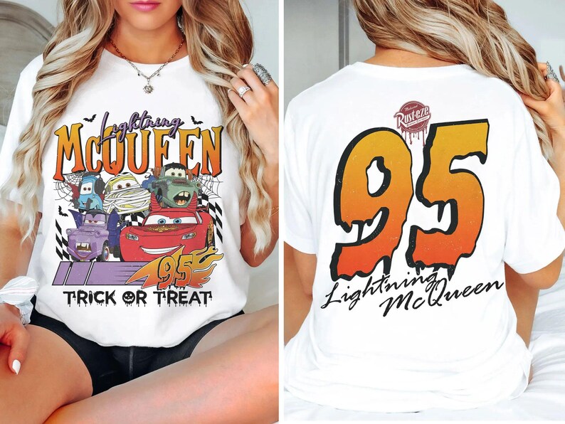 May include: White t-shirt with a Halloween-themed design featuring Lightning McQueen and other Cars characters. The front has the text "Lightning McQueen" and "Trick or Treat". The back displays a large "95" and "Lightning McQueen".