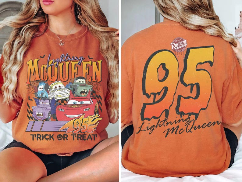May include: Orange t-shirt featuring Lightning McQueen and other Cars characters with the text "Trick or Treat" and "95". The back of the shirt displays a large "95" and "Lightning McQueen" text.