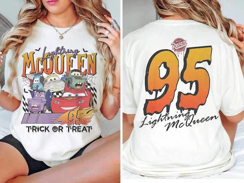 May include: Cream-coloured t-shirt with a Halloween-themed Lightning McQueen design. The front displays the text "Lightning McQueen" and "Trick or Treat" with cartoon cars. The back shows a large "95" and "Lightning McQueen" text.