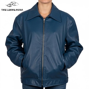 May include: A dark teal leather jacket with a zipper closure and a collared neckline. The jacket has two front pockets and the text "THE LEONS AURA" at the top left.