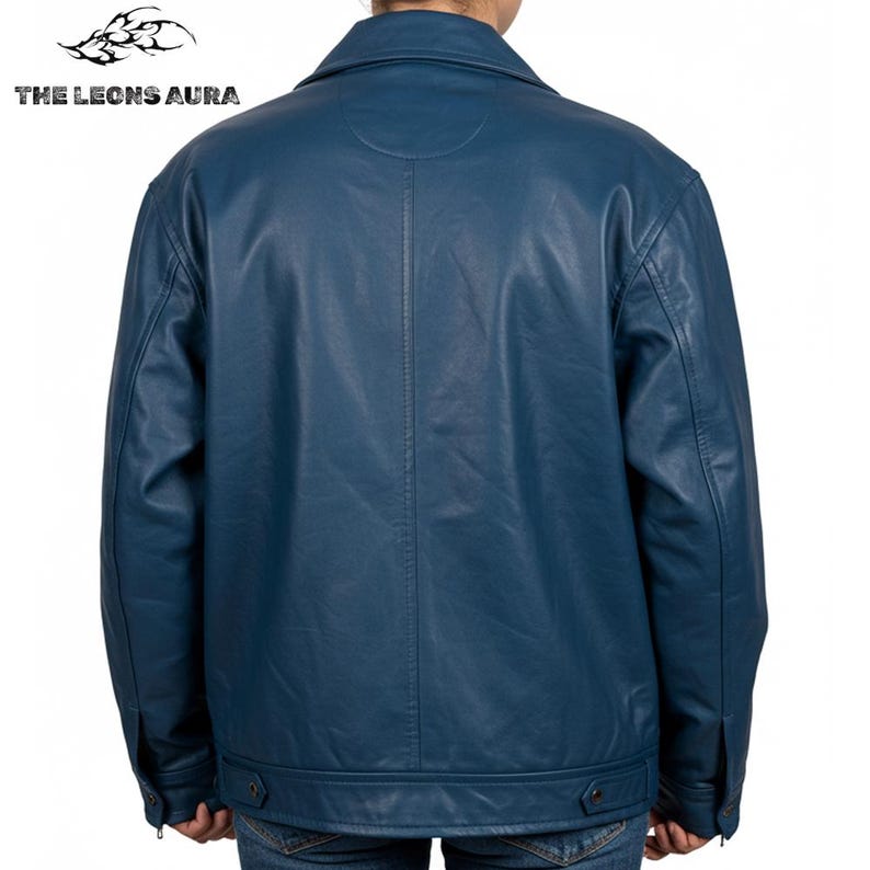 May include: A teal leather jacket with a classic collar and buttoned cuffs. The back view of the jacket shows a vertical seam down the center. The text "THE LEONS AURA" is visible in the upper left corner.