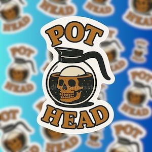 May include: A sticker featuring a coffee pot design with the words "POT HEAD" in brown letters. The coffee pot contains a skull. The sticker has a white border and is set against a blue background with blurred coffee pot images.
