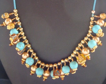 Turquoise, Gold and Tan Bubble Necklace on Turquoise Leather