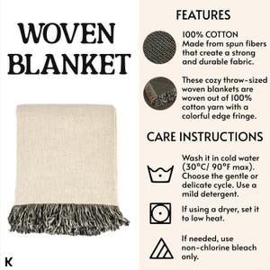 May include: A folded woven blanket with a cream-colored body and a black and gray fringe. The blanket is made of 100% cotton and is throw-sized. The image also includes text that says "WOVEN BLANKET".