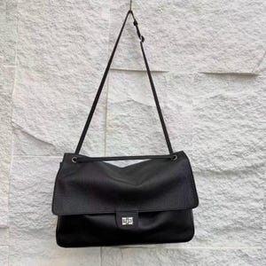 Back view of a black leather handbag featuring a stitched exterior pocket, premium textured leather surface, adjustable shoulder strap, and refined edge finishing. The minimalist back design highlights handcrafted quality, durability, and practical storage. This elegant leather purse combines classic style with everyday functionality, making it perfect for modern fashion, work, travel, and casual outings.