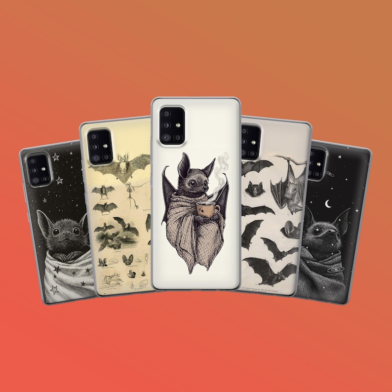 May include: Five phone cases with bat-themed designs. The cases feature illustrations of bats in various poses, including one wrapped in a shawl, holding a cup of coffee. The cases have a black, cream, and beige color scheme.