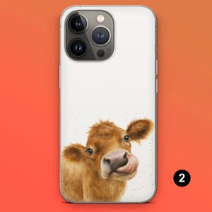 May include: White phone case featuring a watercolor illustration of a brown cow with its tongue out. The cow's head is centered, with a white background. The phone case has a clear border and a camera cutout.