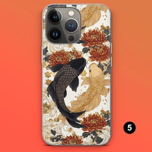 May include: A phone case featuring a black and gold koi fish design with red and gold floral accents. The case has a white background with a repeating pattern of gold and white waves. The phone case has a camera and flash.