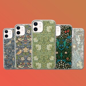 May include: A collection of five phone cases with various floral and bird patterns. The cases feature designs in shades of blue, green, and cream, with intricate details. The cases are displayed against an orange background.