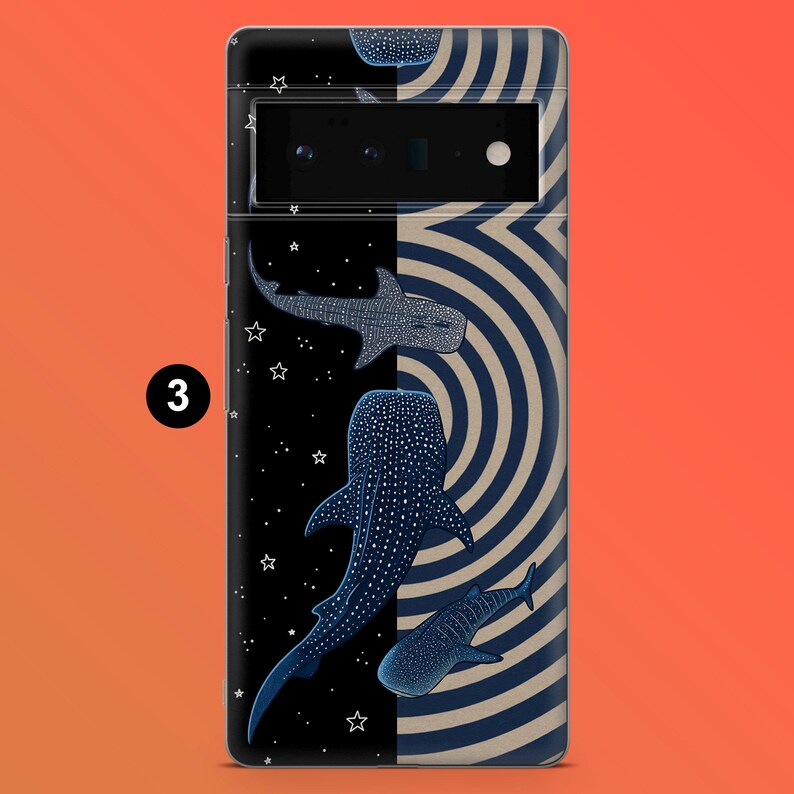 May include: A phone case featuring a design with whale sharks in a dark blue color with white spots. The case has a black background with white stars on the left side and a beige and blue striped pattern on the right side.