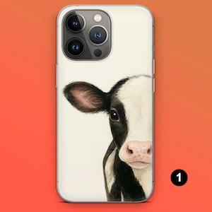May include: A white phone case featuring a watercolor illustration of a black and white cow's face. The cow's eye, ear, and pink nose are visible. The phone case has a clear border and a camera cutout.
