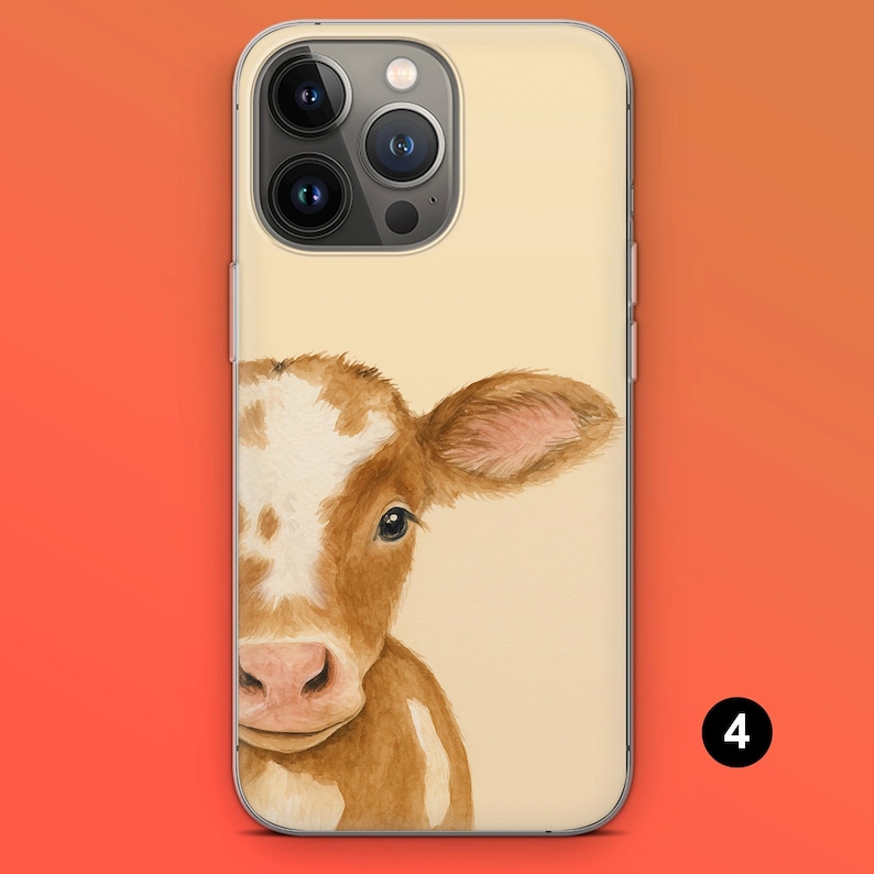 May include: A phone case featuring a watercolor illustration of a brown and white cow's face. The case has a light beige background and a clear border. The cow's face is centered, with its eye and ear visible.
