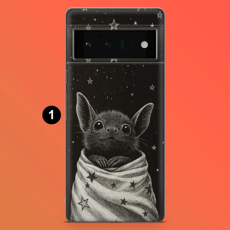 May include: A black phone case featuring a cute bat illustration wrapped in a blanket with star patterns. The background is black with white stars. The phone case has a camera and flash.