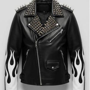 May include: Black leather jacket with silver spike studs on the collar and shoulders. The sleeves have white flame designs. Features a zipper closure and multiple pockets. A bold, edgy fashion statement.