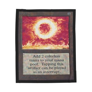 May include: A rectangular card with a black border featuring the text "Sol Ring" at the top. The card's artwork depicts a fiery ring against a red and orange background. Text on the card reads "Add 2 colorless mana to your mana pool."