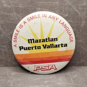 PSA A Smile Is A Smile In Any Language Macallan Puerto Vallarta Vintage Pinback Button