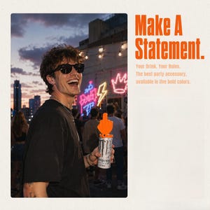 May include: An orange plastic middle finger topper attached to a white and black Monster Energy drink can. The text on the right reads: Make A Statement. Your Drink. Your Rules. The best party accessory, available in five bold colors.
