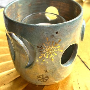 Candle Holder in Light Green with cut outs and Gold Snowflakes