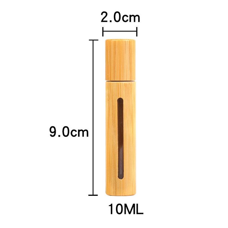May include: A light brown bamboo bottle with a removable cap. The bottle is 9.0 cm tall and 2.0 cm wide, with a 10 ml capacity. The bottle has a vertical window to view the contents.
