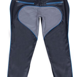 A pair of black leather pants with a gray heart-shaped panel on the seat and blue piping, laid flat, back view.