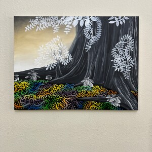 May include: A black and white painting of a tree with white leaves and a colorful patterned ground. The tree has a thick trunk and branches that spread out to the sides. The ground is covered in a pattern of green, yellow, blue, and red.