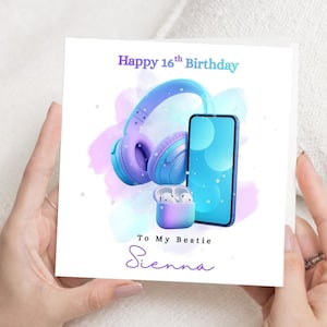 Puede incluir: Tarjeta de felicitación blanca con un diseño de acuarela. Presenta unos auriculares, un smartphone y unos auriculares morados y azules. El texto dice "Happy 16th Birthday To My Bestie Sienna."