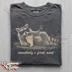Funny Somebody's Feral Aunt Raccoon T-Shirt, Iced Coffee Raccoon Tee, Sarcastic Auntie Gift, Retro Trash Panda Graphic Pepper