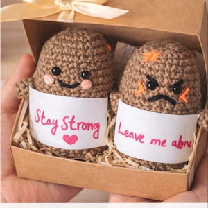 May include: A set of three ceramic mugs with a speckled, matte finish in cream, light grey, and dark grey. Each mug has a simple, minimalist design, ideal for coffee or tea.