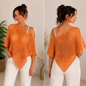 May include: An orange crochet poncho featuring an open-knit diamond pattern with a wide, asymmetrical neckline and pointed hemline, worn over a white camisole and paired with white trousers, showcasing both front and back views of the garment.