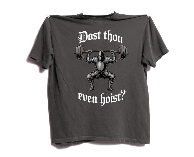 May include: Dark gray t-shirt with a graphic of a knight lifting a barbell. The text "Dost thou even hoist?" is printed above and below the knight illustration in a gothic font.