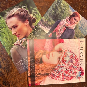 May include: Three different knitting patterns featuring colorful yarn and the text "LOUISA HARDING" and "ENORME L17-04 BRYCE CANYON CIELO ENORME".