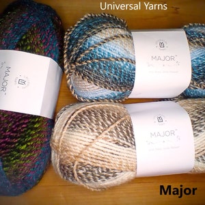 May include: Three skeins of Major yarn in different color combinations. The yarn is a blend of brown, beige, blue, and green. The yarn is labeled "Universal Yarns Major".