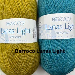 May include: Two skeins of Berroco Lanas Light yarn, one in a mustard yellow color and the other in a teal blue color. The yarn is 100% wool and is made in Peru.