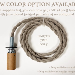 May include: A light fixture hardwire kit featuring a 127 cm tan-coloured twisted pair wire, a metal threaded rod, and a cylindrical socket. Text on the image reads: NEW COLOR OPTION AVAILABLE, 50" (4 feet), LIMITED TIME ONLY, Not available as a plug-in kit.