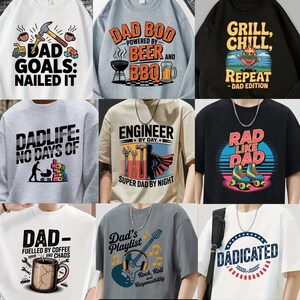 May include: A collection of graphic t-shirts and sweatshirts with various designs. The shirts feature phrases like "Dad Goals: Nailed It," "Dad Bod," "Grill, Chill, Repeat," and "Rad Like Dad." The color palette includes black, white, gray, and beige.