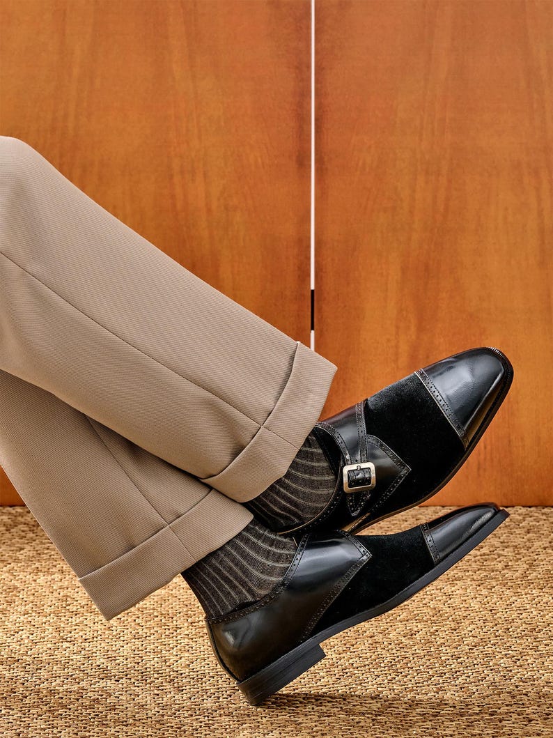 Black leather monk strap shoe side profile buckle detail