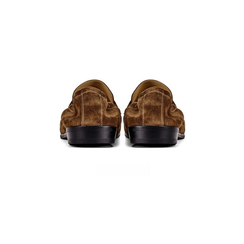 May include: A pair of brown suede loafers featuring a soft, textured upper material and a solid black heel. The shoes are shown from the back view, highlighting the rounded heel counter, the stitched seam detail, and the flat black outsole.