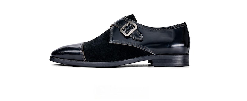 Polished leather upper close up double buckle detail