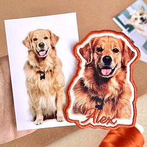 May include: A golden retriever dog patch with an embroidered orange border and the name "Alex" in cursive. Next to the patch is a photo of the same dog. The dog is wearing a blue collar.
