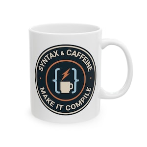 May include: White ceramic mug with a black and blue circular design. The design includes the text "SYNTAX & CAFFEINE MAKE IT COMPILE" around a central graphic of a coffee cup, brackets, and a lightning bolt.