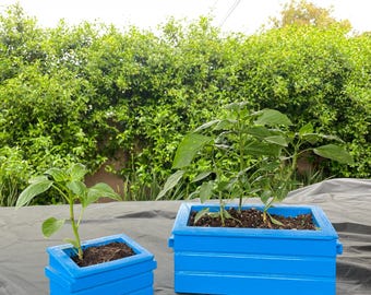 Small Concrete dumpster graffiti flower pot