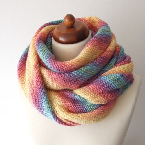 Colorful scarf in rainbow stripes sold handknit from wool and acrylic