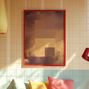 May include: A framed art print with a red border. The artwork features a cloudscape with geometric shapes in shades of brown and beige. The print is displayed on a tiled wall, with a hint of a blue and white tiled section below.