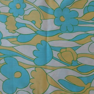 May include: Abstract floral pattern fabric in shades of blue, yellow, and white. The fabric features a repeating pattern of stylized flowers and leaves.