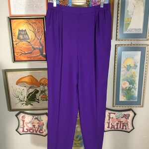 May include: Purple high-waisted pants with a straight leg and a relaxed fit.