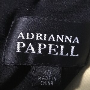 May include: Black label with white text reading "Adrianna Papell" and a smaller black label with white text reading "10 Made in China".