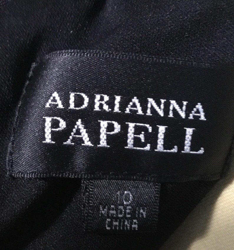 May include: Black label with white text reading "Adrianna Papell" and a smaller black label with white text reading "10 Made in China".